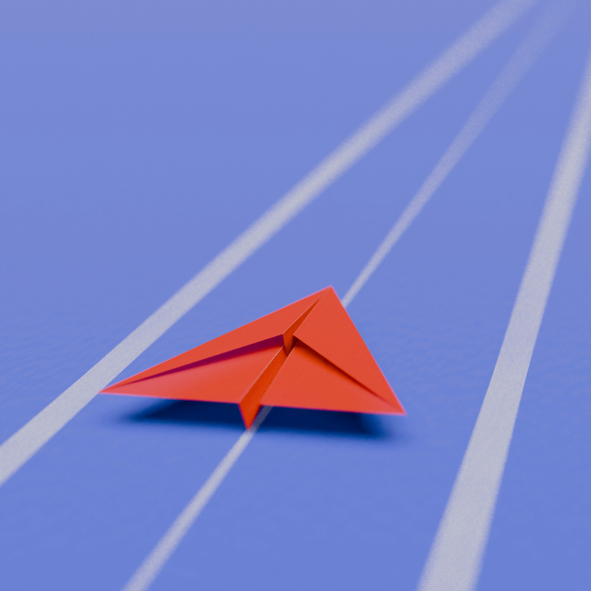 A red paper airplane moving forward on a blue track